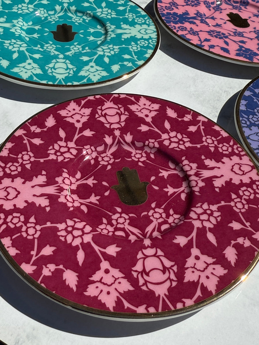 Close-up of Porland Glamorous Tea Set saucers with ethnic floral patterns